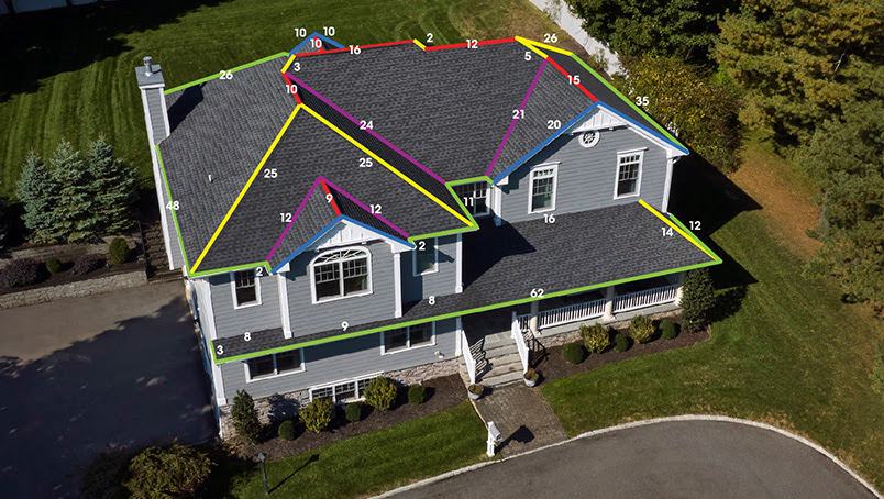 Aerial view of residential home with roof measurement markings and annotations